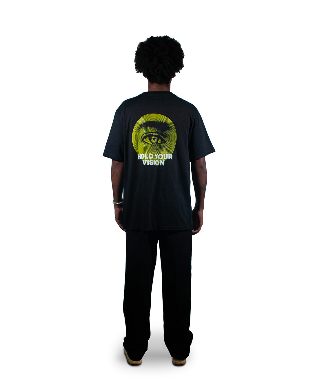 Black t-shirt with surreal eye graphic print and balance scales.